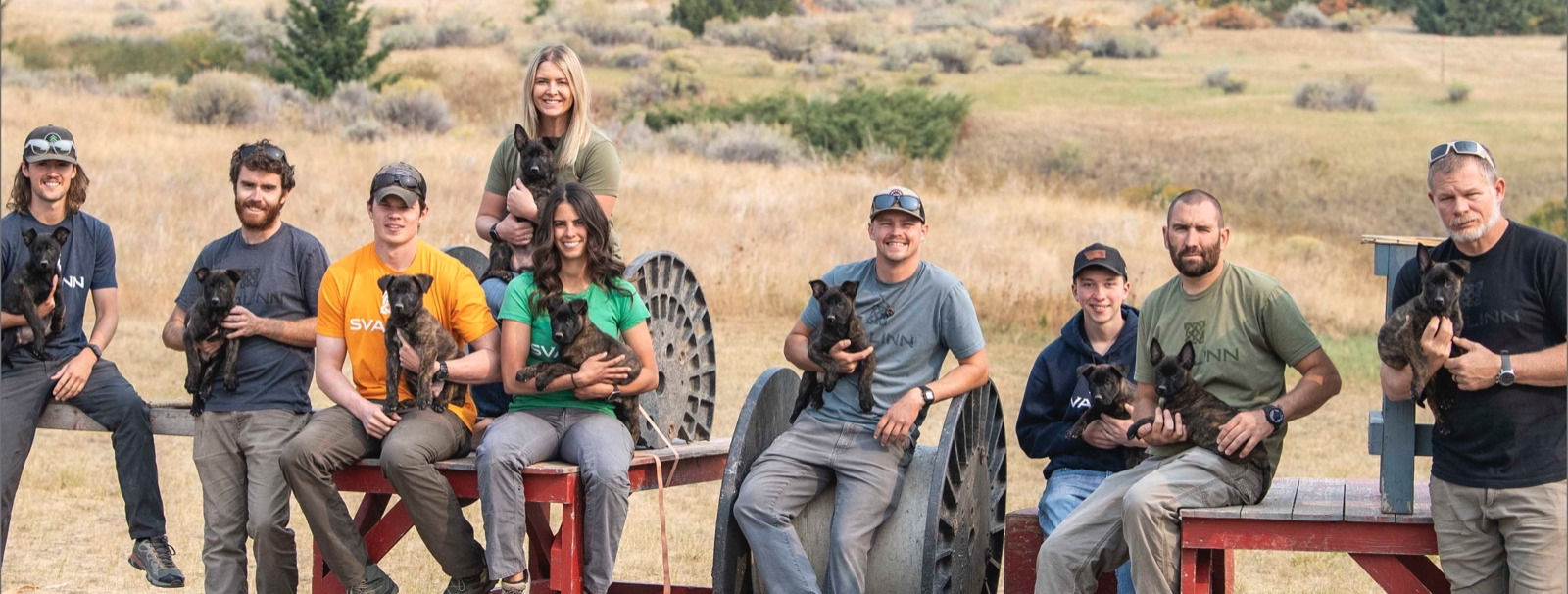The Svalinn team posing with some puppies